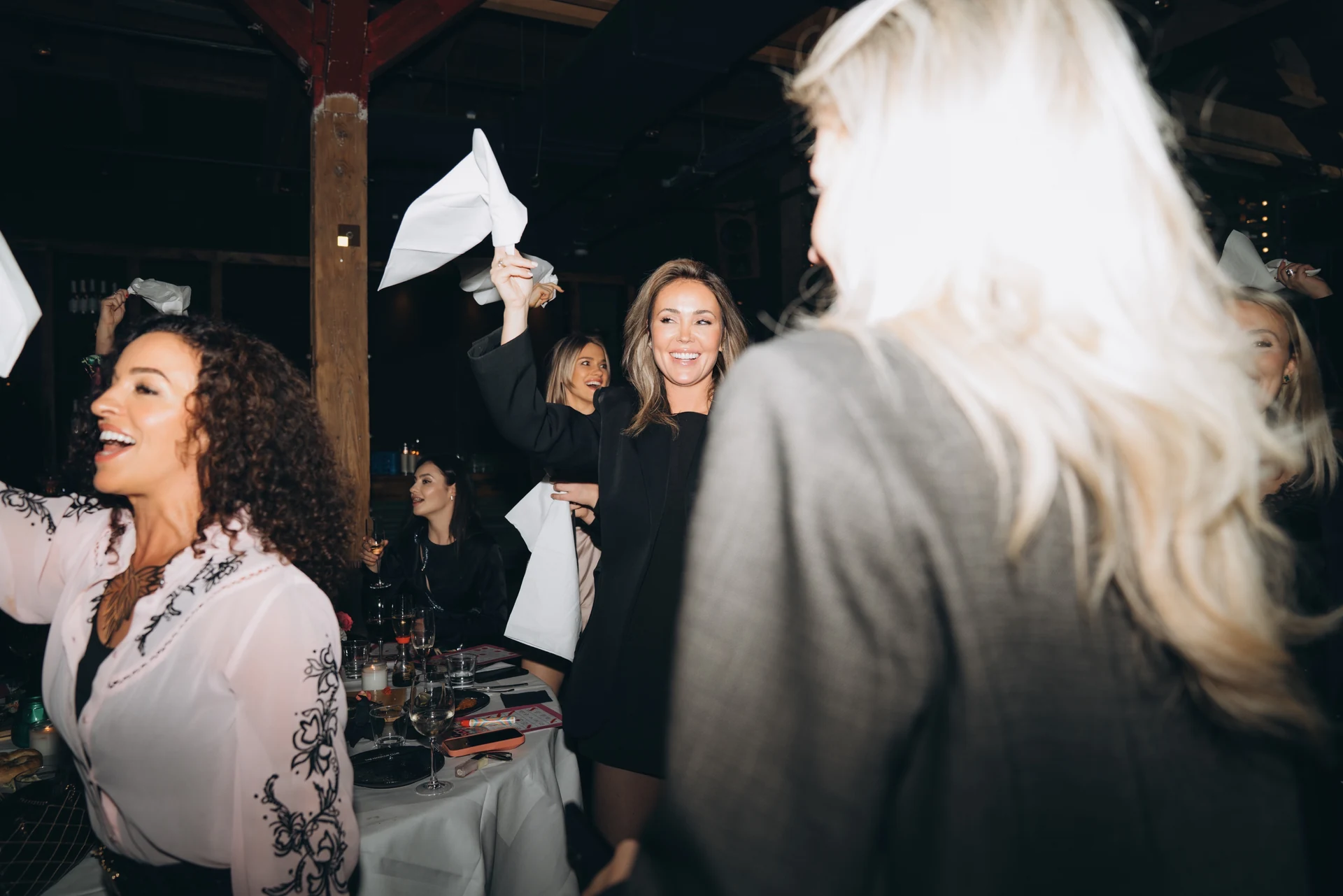 Guest waving a napkin during a lively celebration