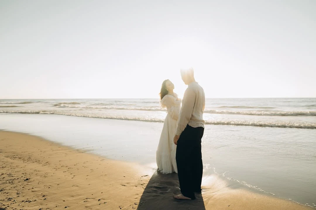 Couple embracing at the water’s edge