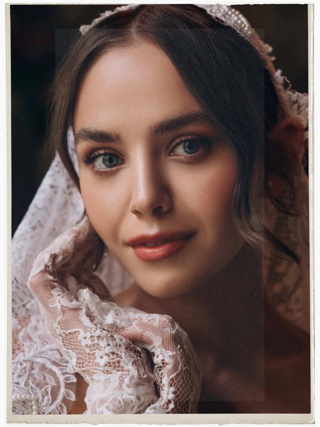 Close bridal portrait framed by lace