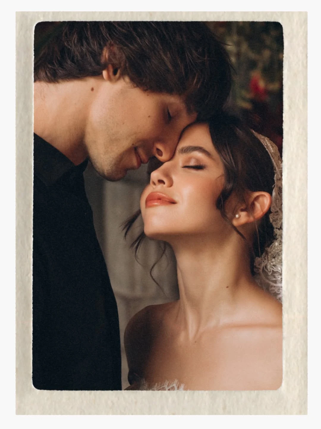 Couple leaning close in a warm, intimate bridal portrait